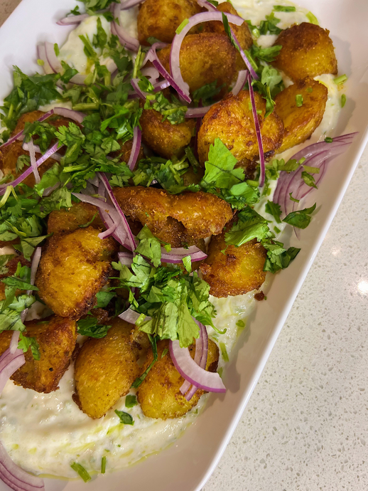 Indian Spiced Roast Potatoes with Green Chilli and Garlic Yoghurt Sauce